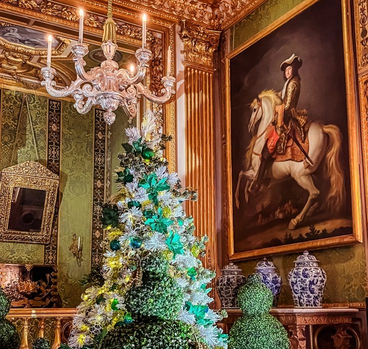 Elegant Christmas Salon Vaux-le-Vicomte Elegant Vaux-le-Vicomte salon with green and gold décor, chandelier and Christmas tree beside an equestrian portrait