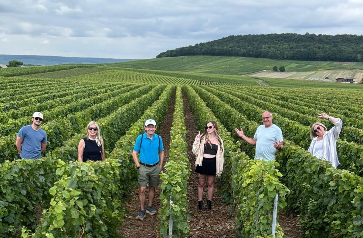 Private Champagne Day Trip from Paris | Full-Day Vineyard Tour with Expert Guide & Tastings Private Champagne Day Trip from Paris - group in Champagne vineyards with Paris and Beyond Tours expert guide