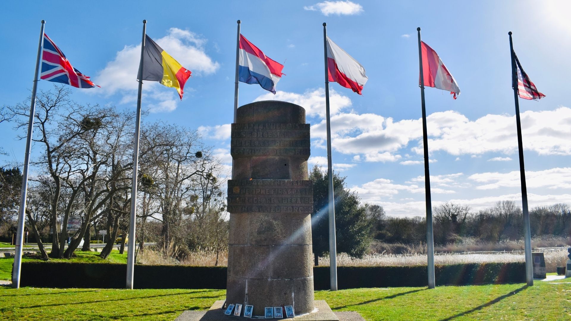 Normandy D-Day Liberation Memorial Allied Nations Flags Tour Paris Beyond Normandy D-Day liberation memorial Allied nations flags monument - Paris and Beyond Tours WWII Normandy memorial tour France
