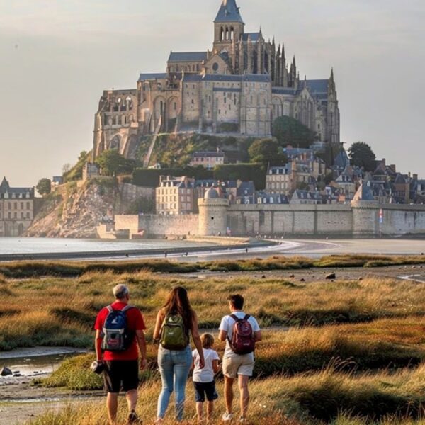Family walking tidal flats Mont Saint-Michel golden hour sunset low tide - Paris and Beyond Tours private tour from Bayeux Caen